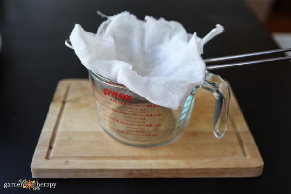 Setting up the Cheesecloth to strain herbal balm