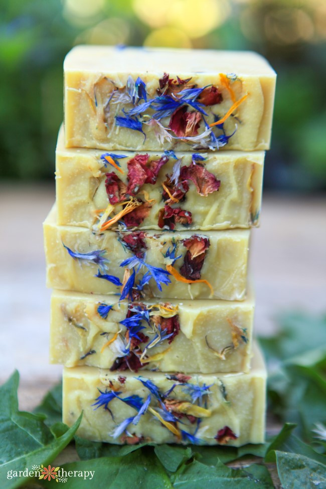 Stack of homemade soap with dried flower petals inside