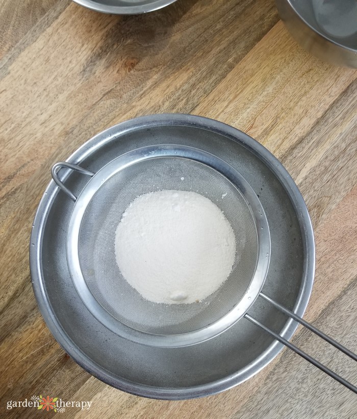 Sift the dry ingredients for Aromatherapy Shower Steamers