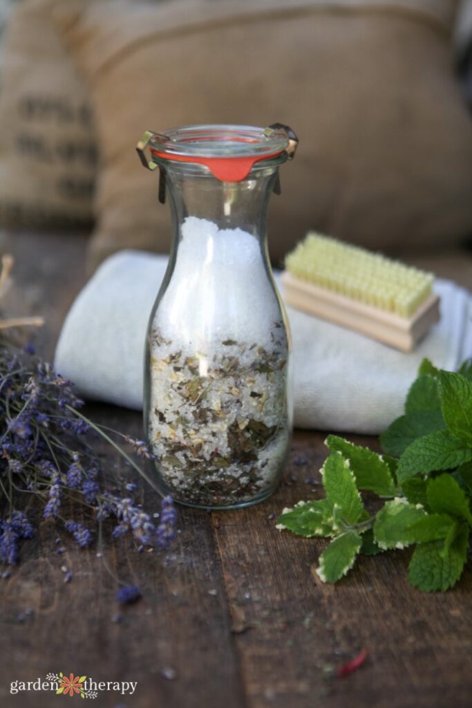 glass vase with oatmeal bath ingredients inside