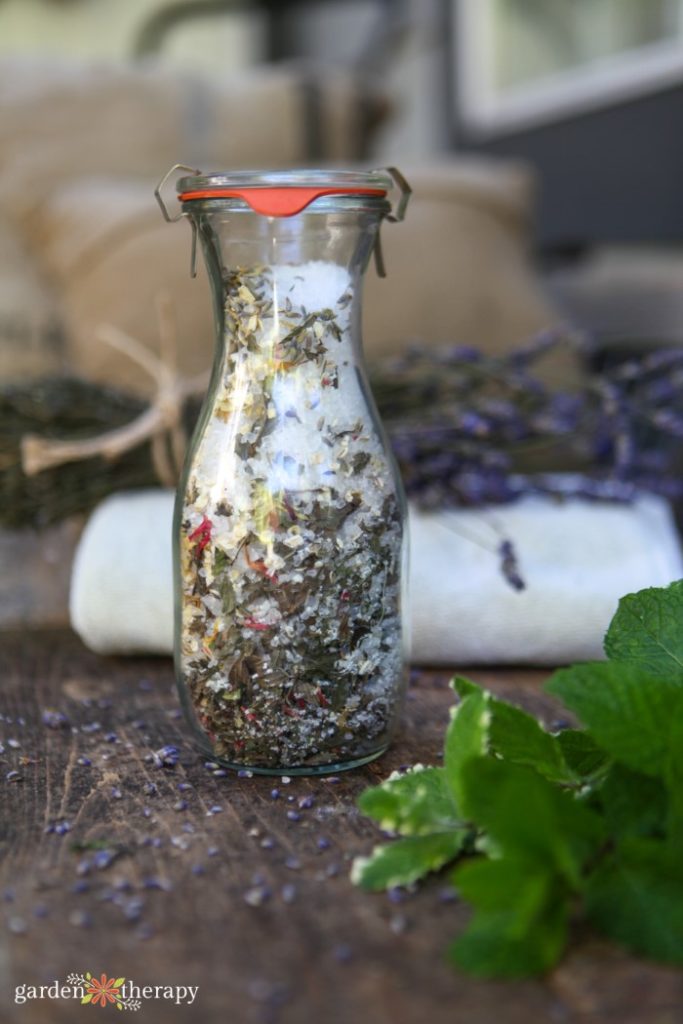 glass lidded vase with diy oatmeal bath mix in it