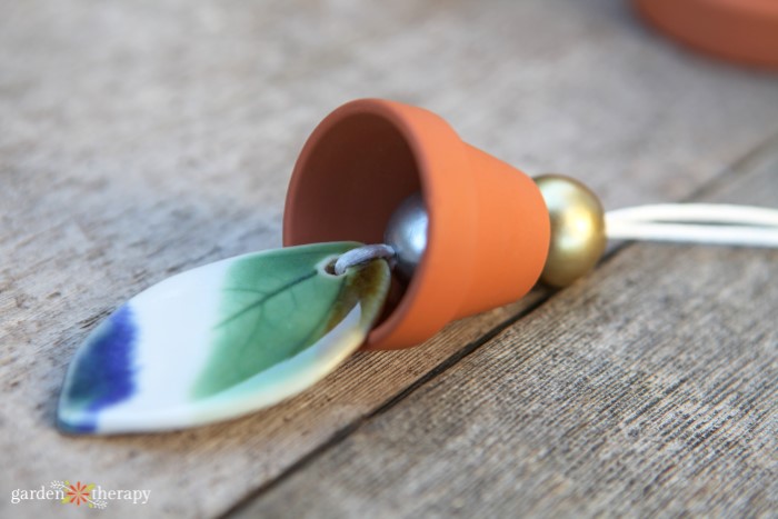 a pendant and terracotta pot on a cord