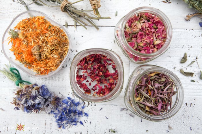 Dried flower petals in jars separated by color