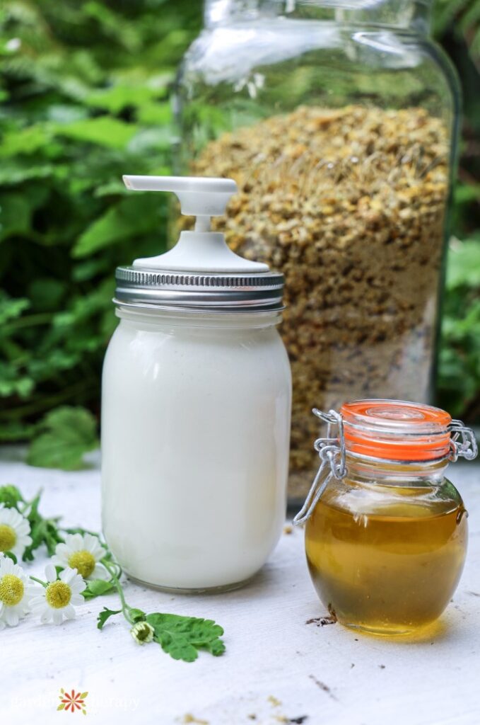 DIY magnesium lotion next to infused chamomile oil