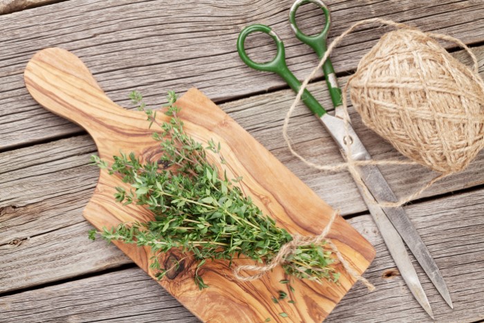 Bunch of garden thyme herb on wooden table