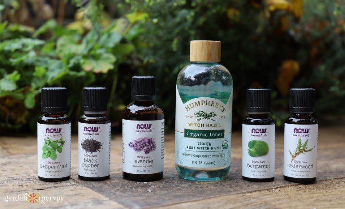 DIY aftershave ingredients including witch hazel and essential oil bottles