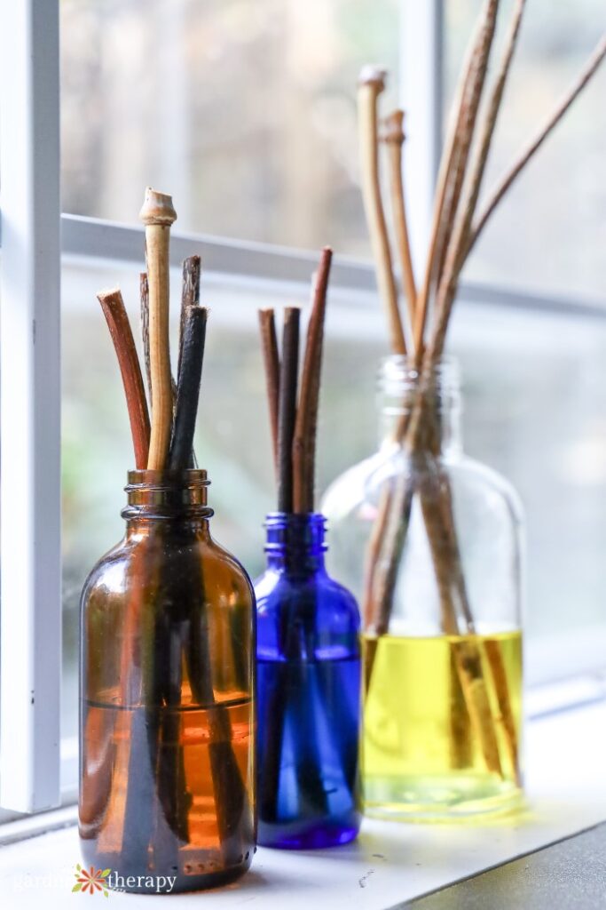 Colorful jars filled with DIY reed diffuser oil
