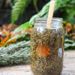 jar of herbal hair rinse made with ACV