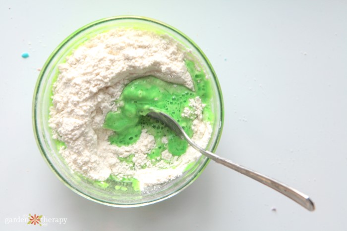 mixing diy playdough with green dye