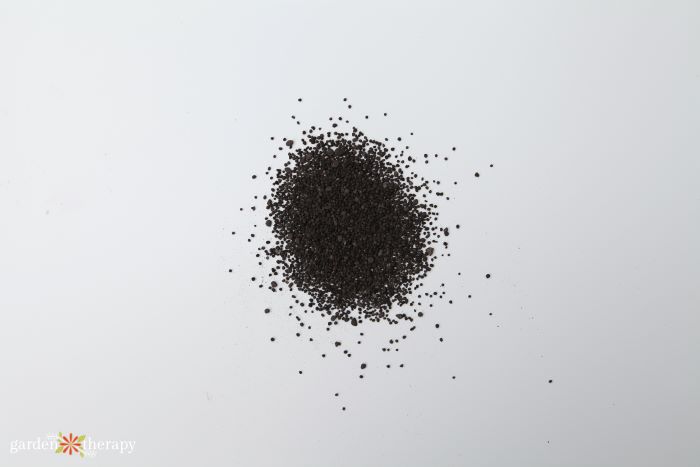 Rock phosphate pile on white background