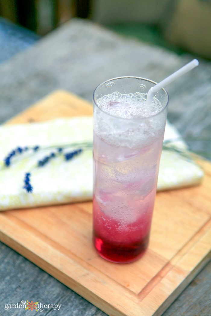 lavender lemonade drink on a wooden tray