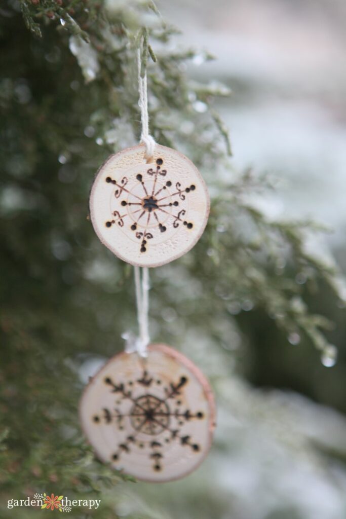 wood slice ornament with snowflake design
