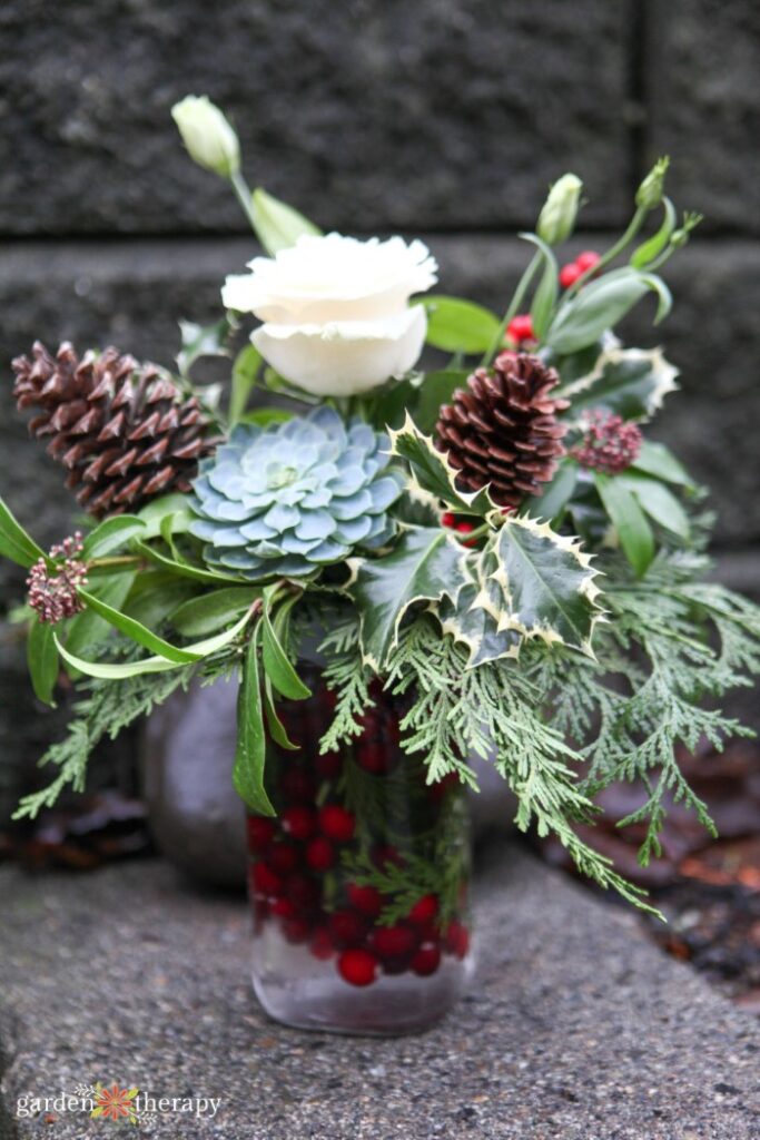 flower bouquet with pinecones and greenery 
