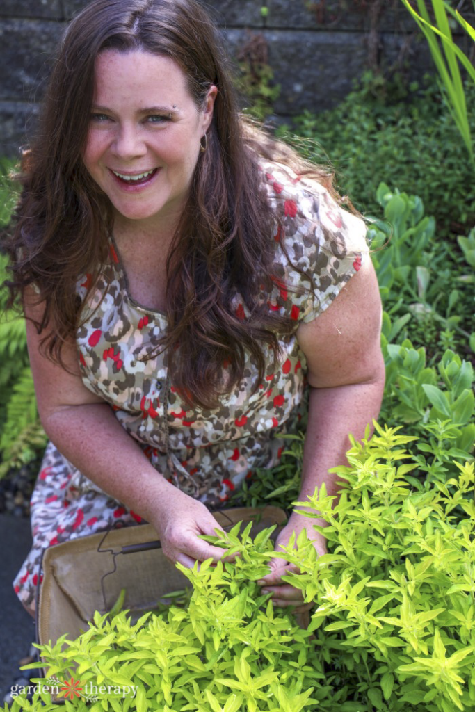 Stephanie in the garden talking to plants