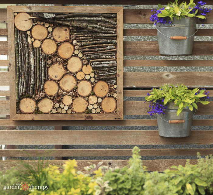 bug hotel on a fence