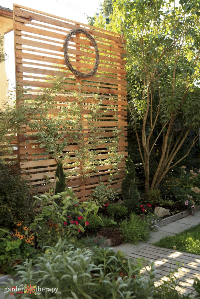 wood slat privacy screen in a garden