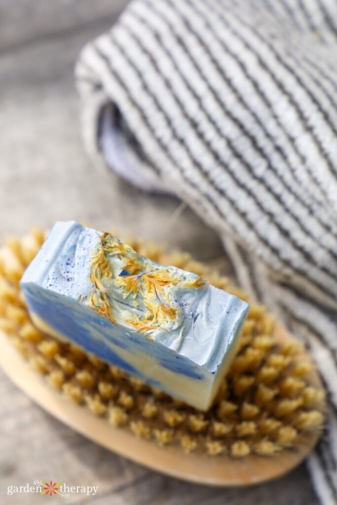 peppermint soap recipe sitting on a nail brush