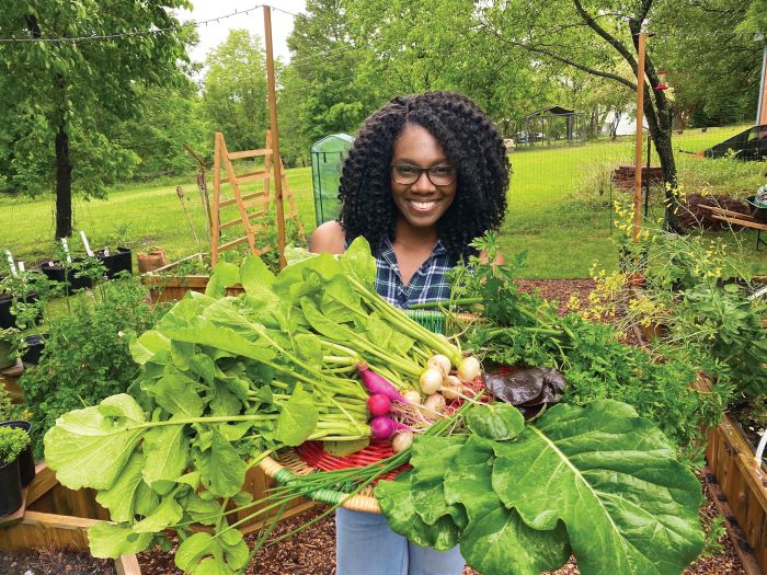 Ashlie Thomas gardener with her bounty 