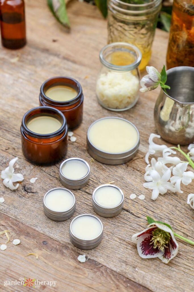 Table filled with homemade salves and balms