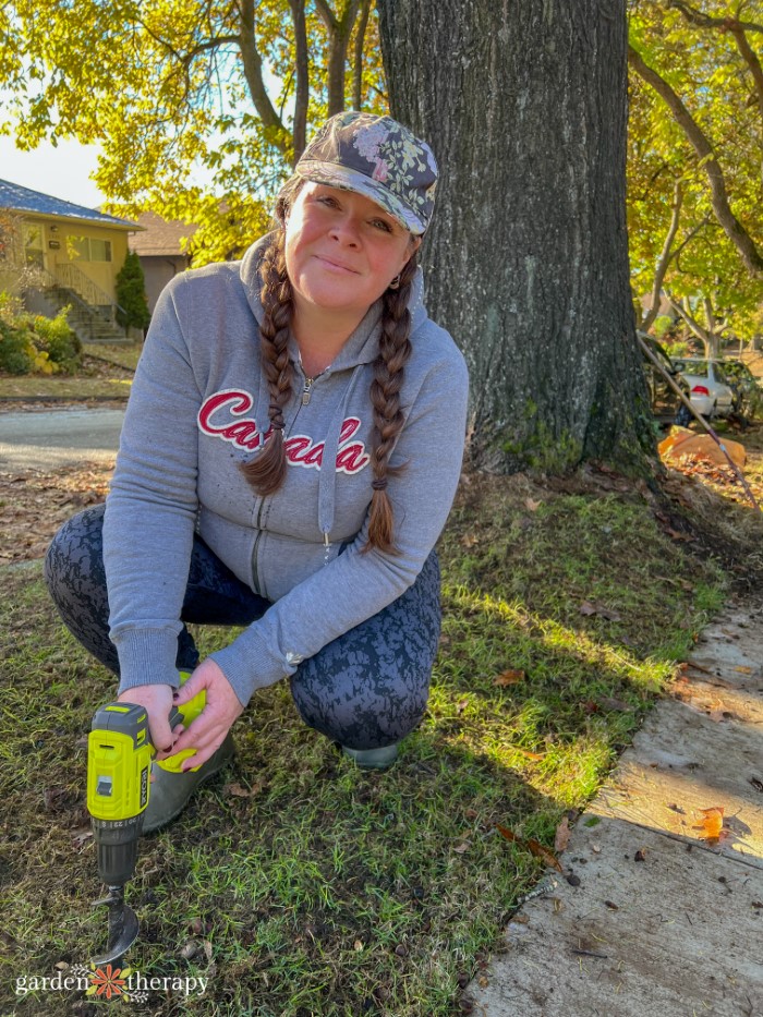 Stephanie with the power planter in front of large oak tree