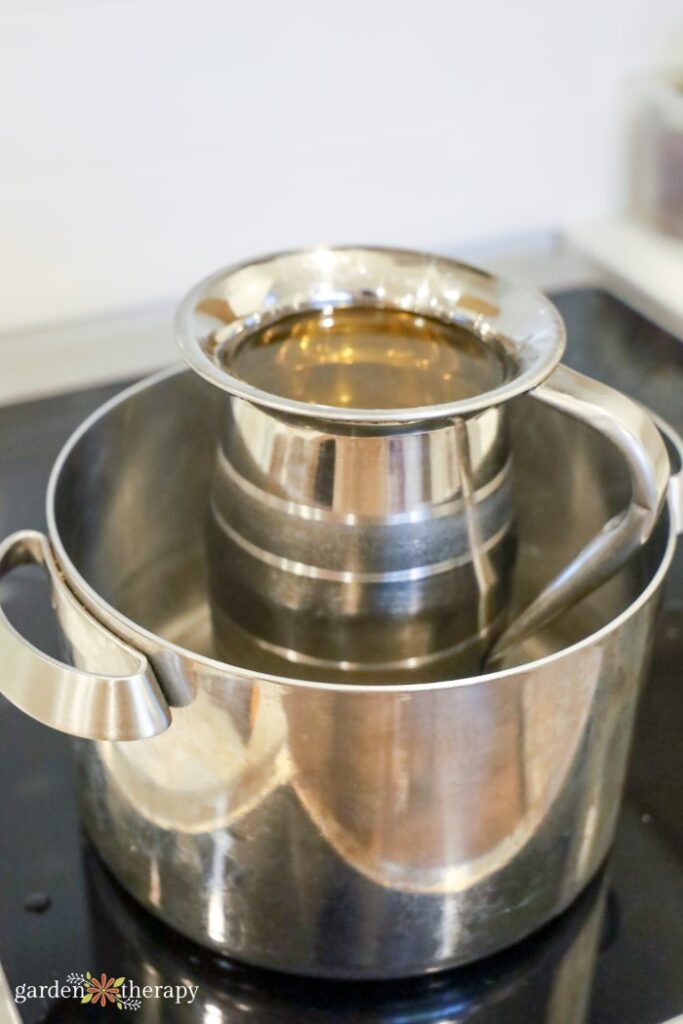 double boiler with oils for soap making
