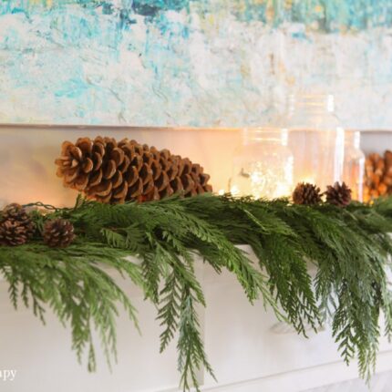 cedar Christmas garland with large pine cones and fairy lights