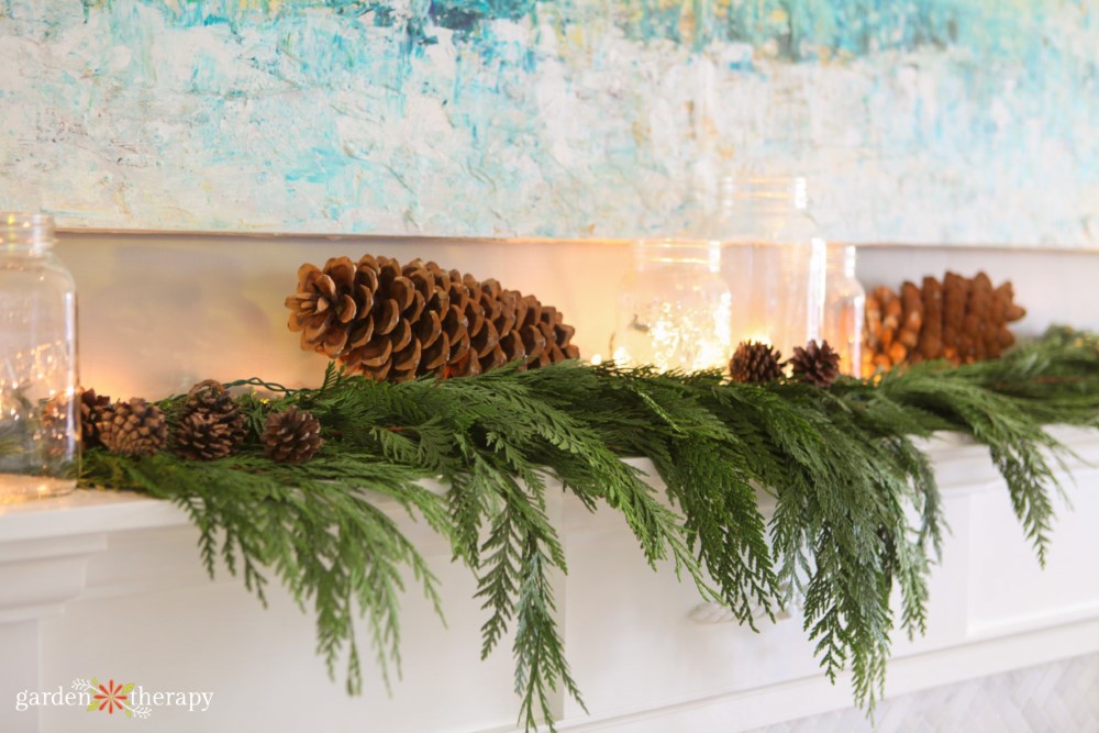 cedar Christmas garland with large pine cones and fairy lights