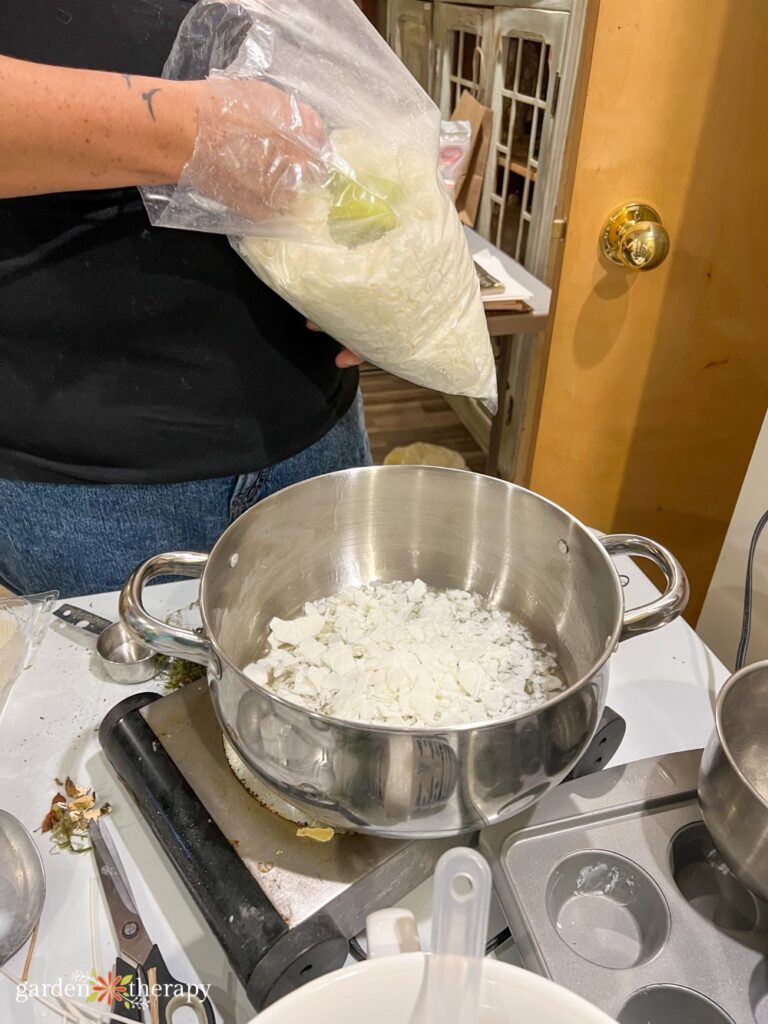 melting soy wax flakes in a pot