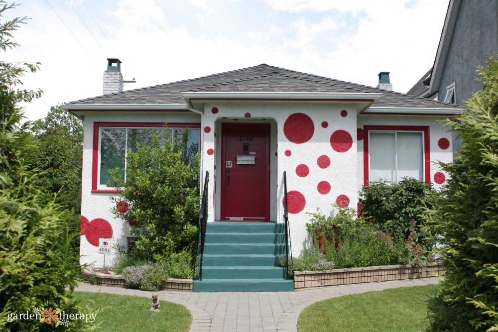 East Vancouver white bungalow painted with red polka dots