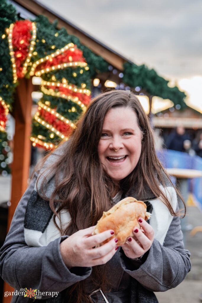 Stephanie holding food at Christmas market