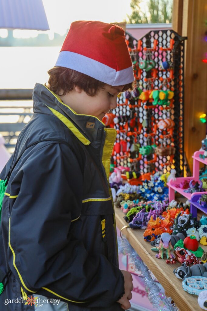 Kiddo shopping at a stall at Shipyards Christmas Market