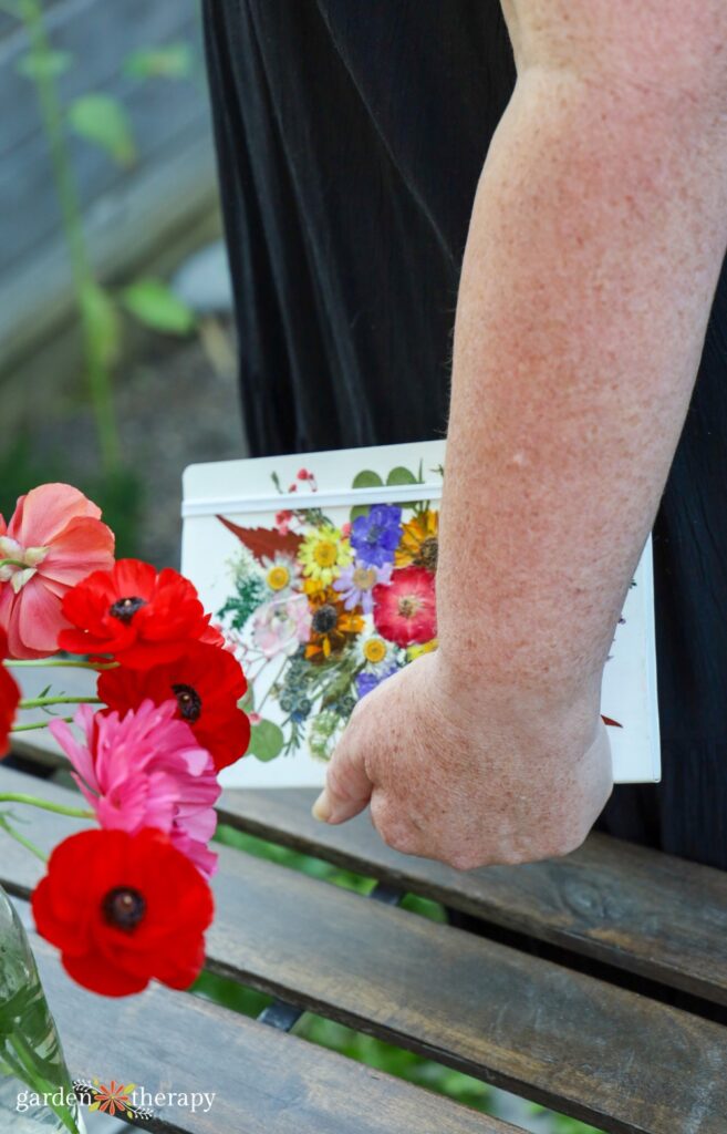 hand holding flower journal