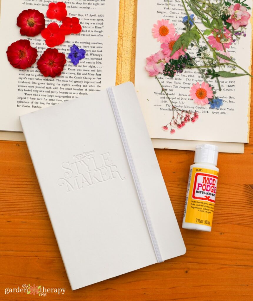 empty notebook and crafting supplies to make a garden journal