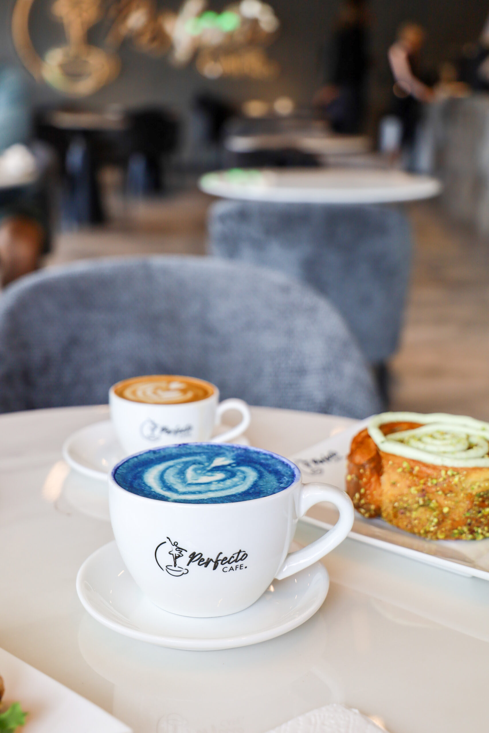 lattes in coffee cups at a cafe