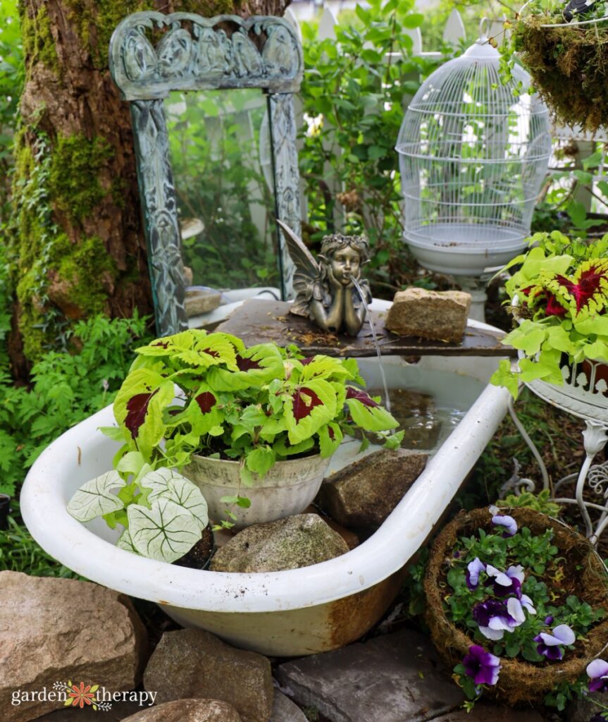 bathtub repurposed into fountain and planter