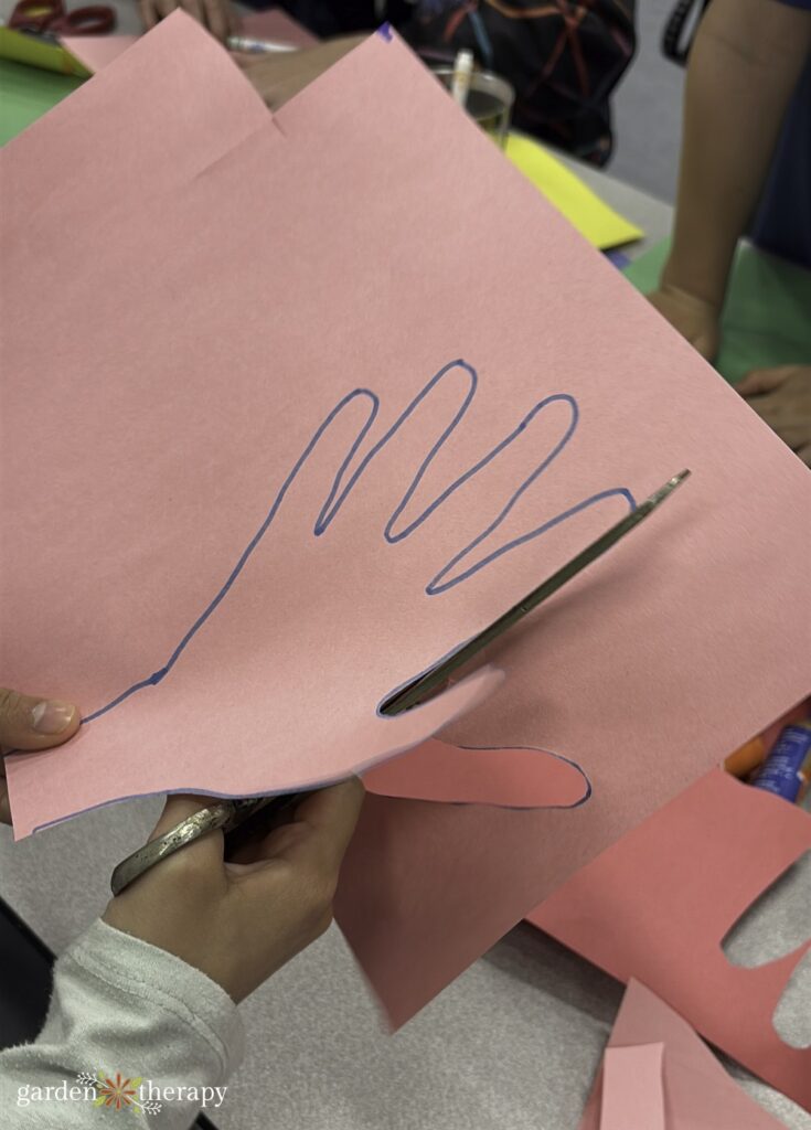 cutting out hand print for paper lilies