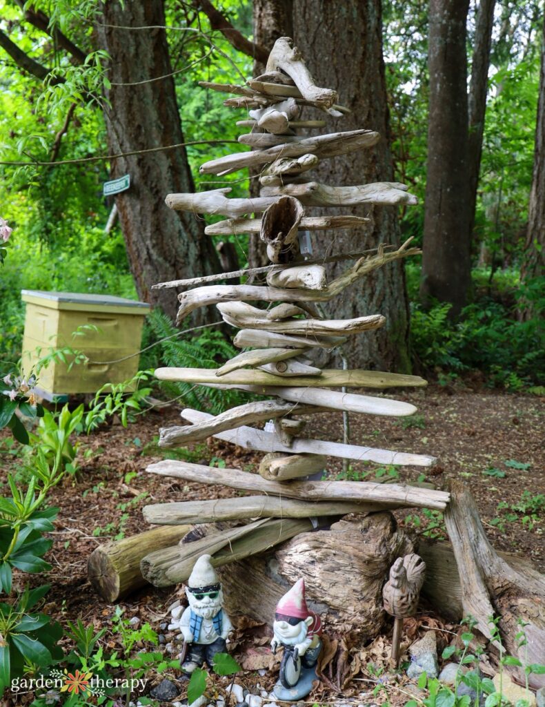 hanging driftwood tree with gnomes at the base