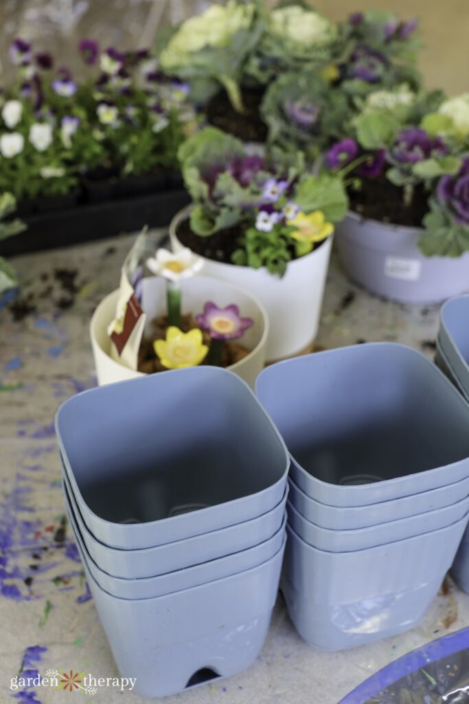 stack of blue potting containers
