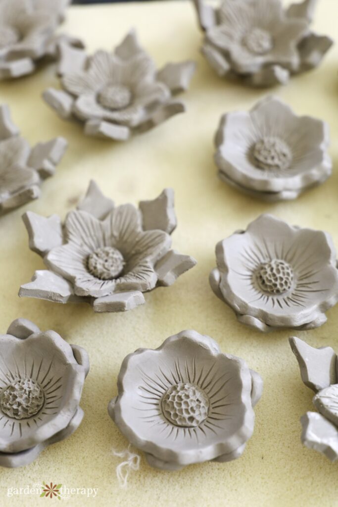 top of clay bee cup flowers before firing