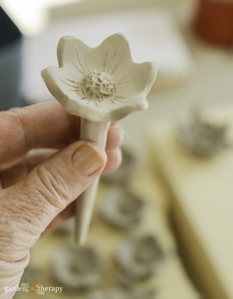 completed clay bee cup before painting